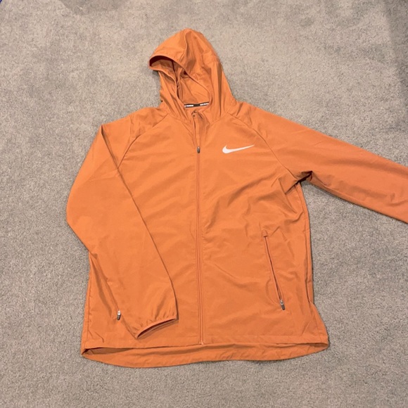 orange nike running jacket